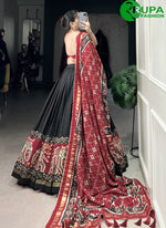 Load image into Gallery viewer, Gorgeous Black Color Tussar Silk Lehenga Choli with Patola Print Work