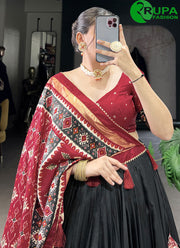 Gorgeous Black Color Tussar Silk Lehenga Choli with Patola Print Work